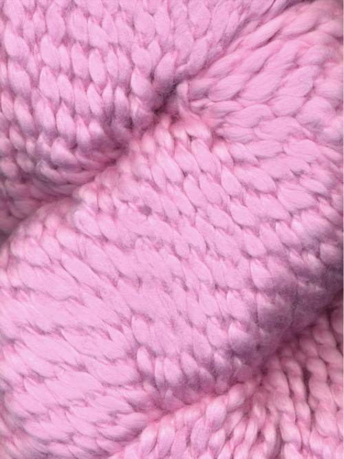 Close-up of chunky-knit Juniper Moon Farm Bud yarn texture in light pink, 100% GOTS certified organic Peruvian cotton.