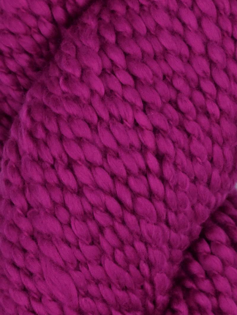 Skein of Juniper Moon Farm Bud bulky yarn in magenta pink, made from 100% GOTS certified organic Peruvian cotton